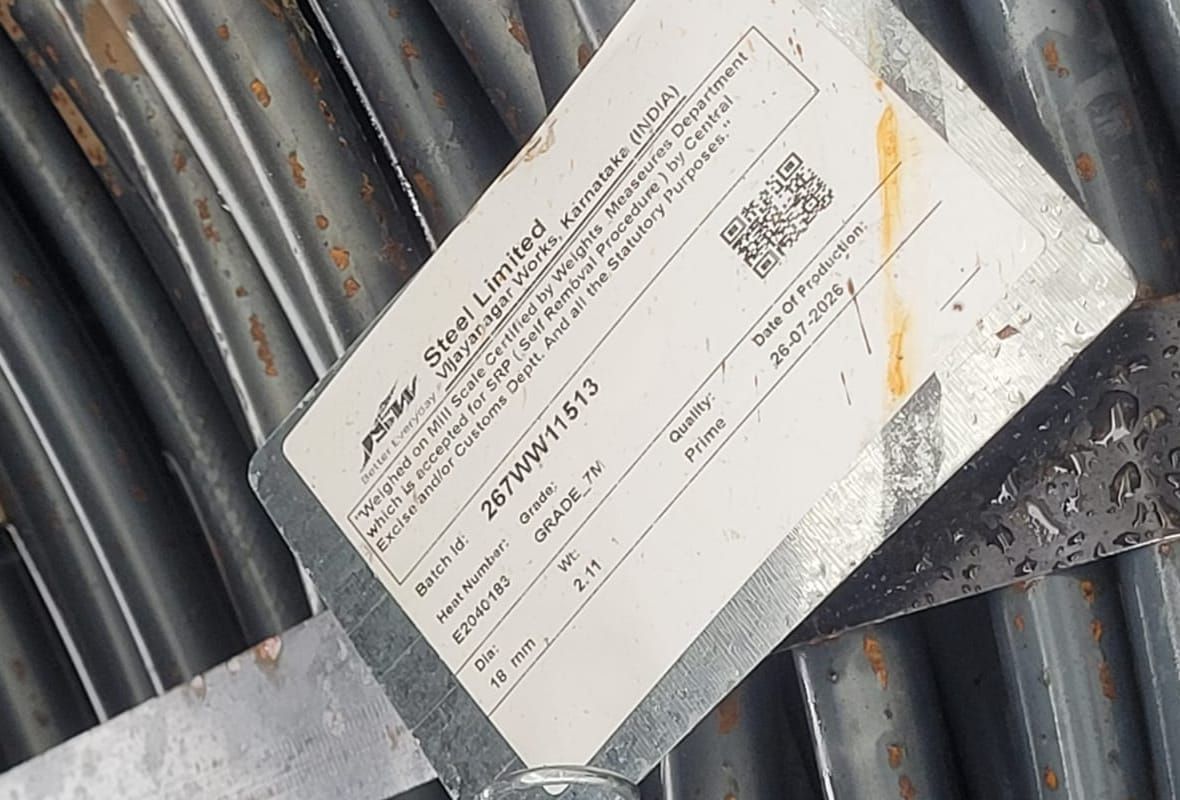A JSW Steel mill tag attached to a wire rod coil in our warehouse, showing the mill, batch and heat numbers